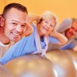 Photo of a group exercising on inflatable exercise balls