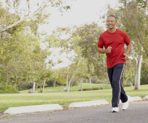 Senior Man Jogging In Park