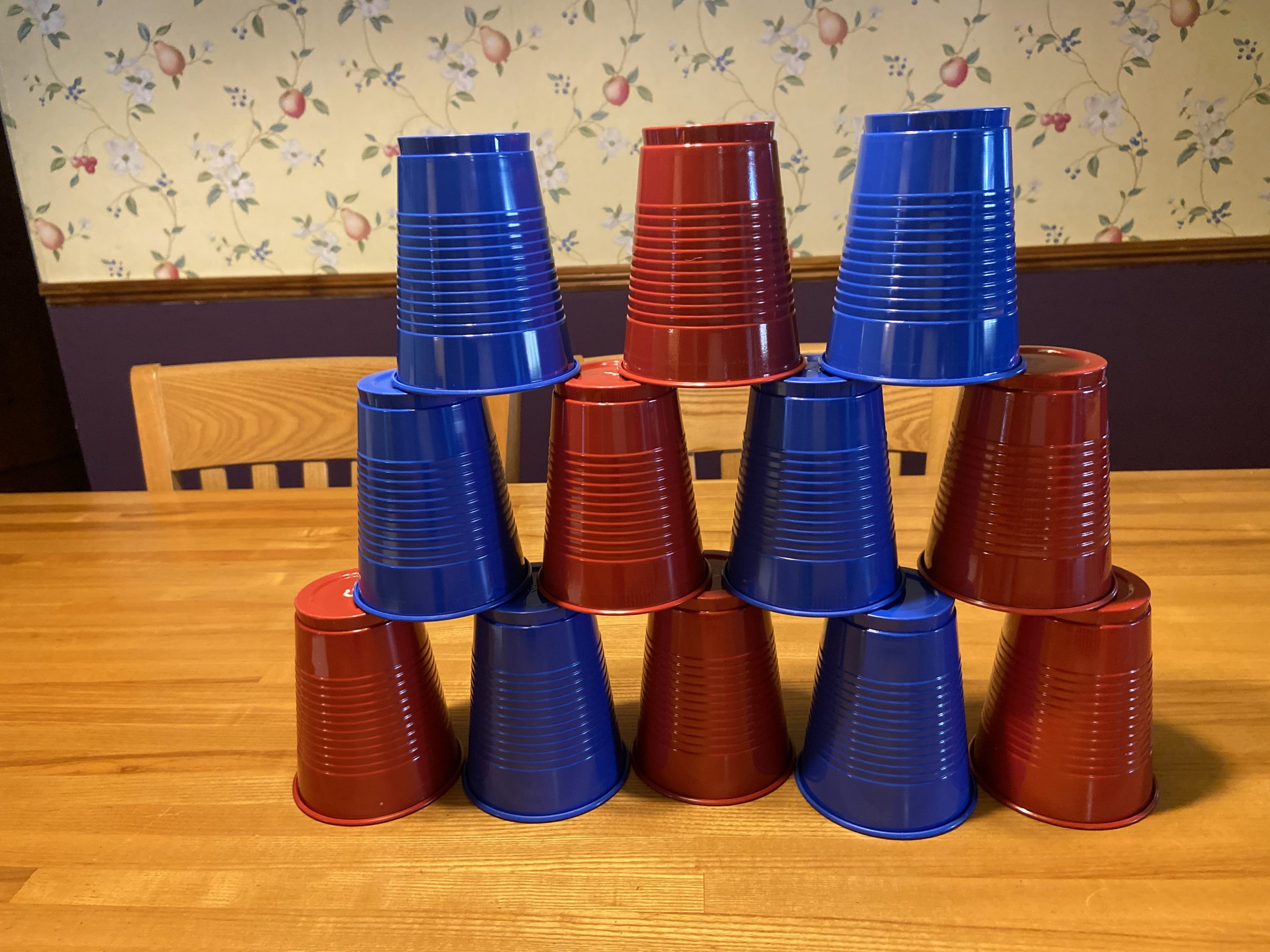 Photo of blue and red solo cups, stacked on top of each other