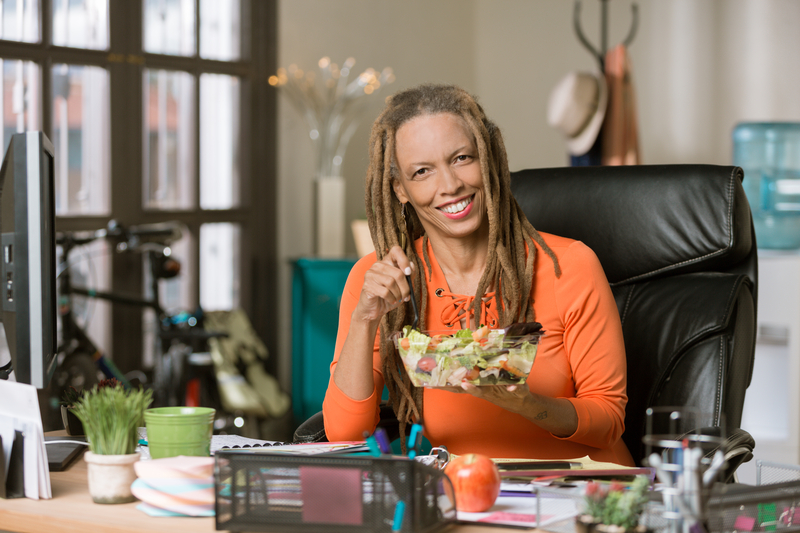 Woman eating a salad.