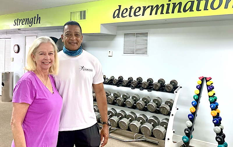 Image of Pat Harlow and her trainer at the gym.