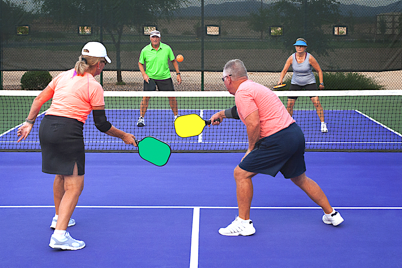 Image of group of older people playing pickleball