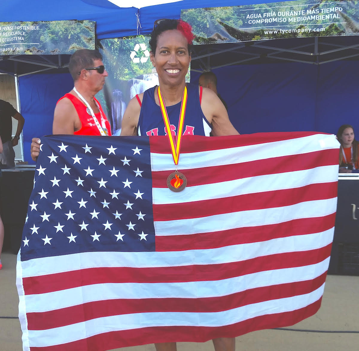 Image of Yvette holding flag.