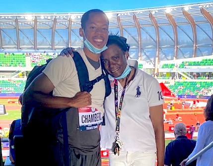 Madonna and Marcus stand together smiling