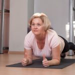 woman planking on a yoga mat