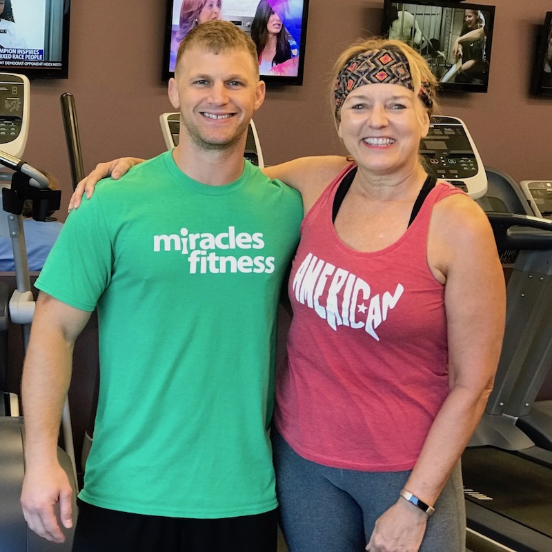 Johnny (a young man in a miracles fitness shirt) and terry (an older women) standing together.