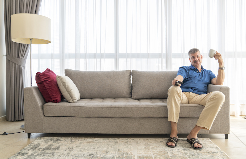 Man sitting on couch