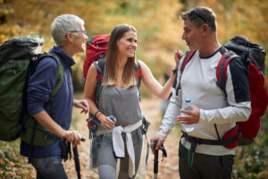 2 women and 1 man hiking